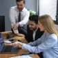 IT Staff Augmentation team working in front of a computer