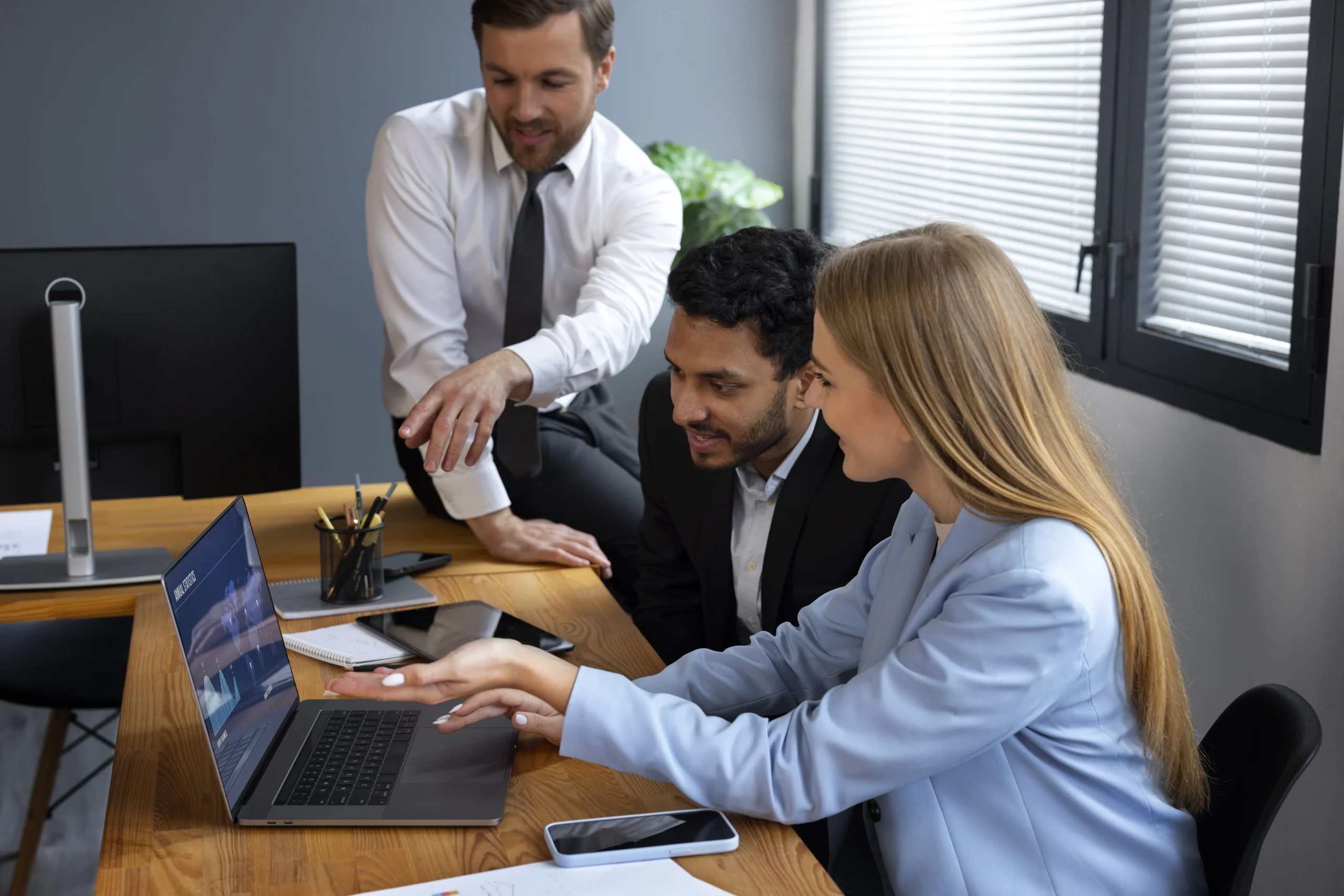 IT Staff Augmentation team working in front of a computer