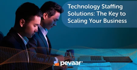 Two people working in front of laptops and papers sitting at a desk. With the text "Technology Staffing Solutions: The Key to Scaling Your Business" and the Pevaar logo.