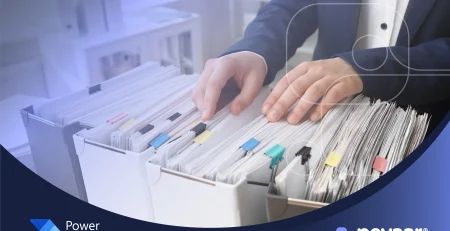 Businessperson organizing paper folders, symbolizing manual credit application processing before automation.