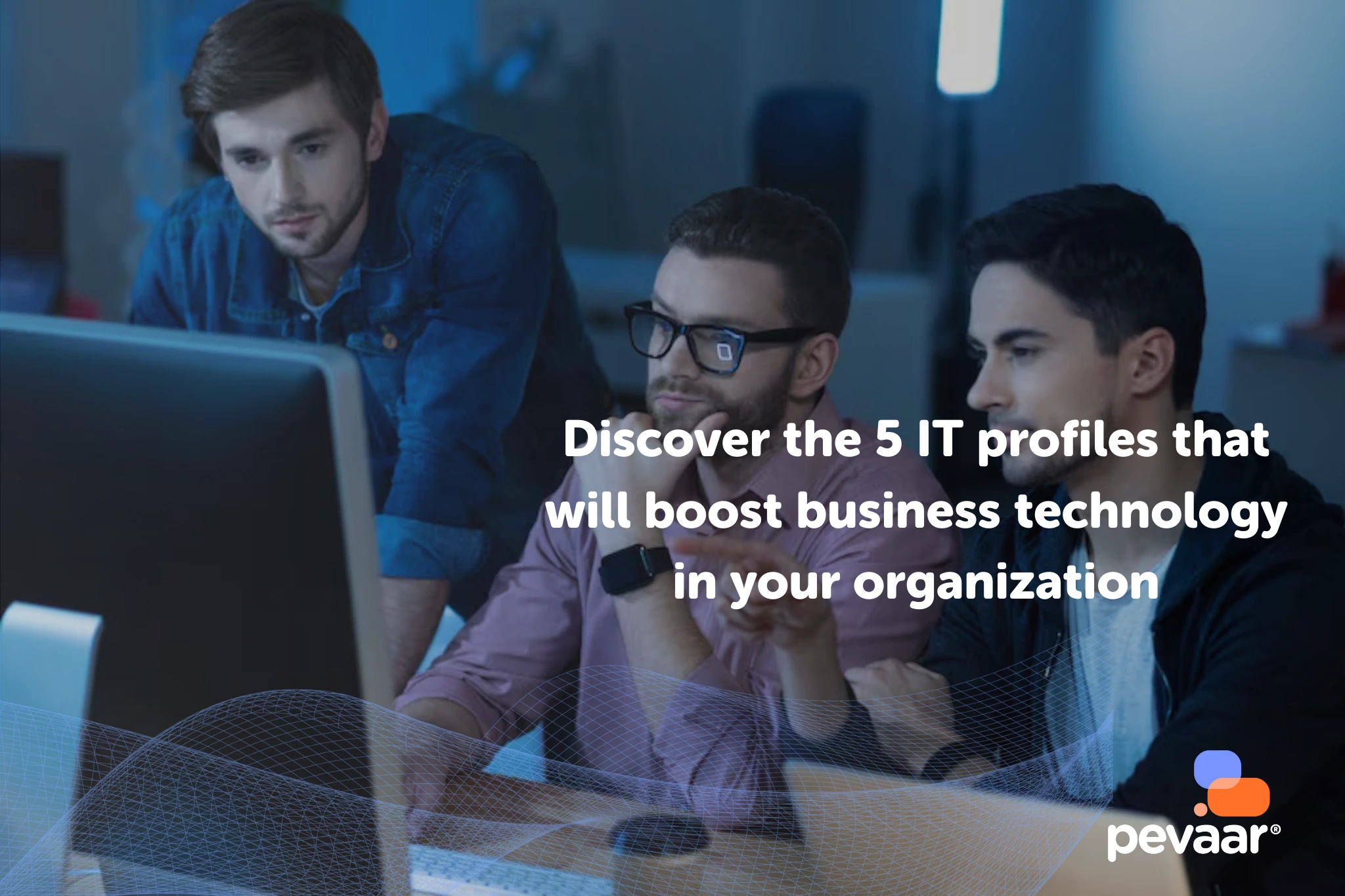 Three IT professionals analyzing data on a computer screen, representing the key IT profiles that boost business technology in modern organizations.