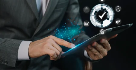 Businessman with his tablet looking at the difference between Chatbot vs AI agent