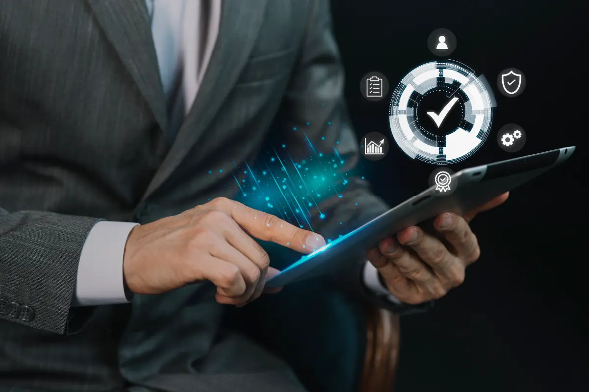 Businessman with his tablet looking at the difference between Chatbot vs AI agent