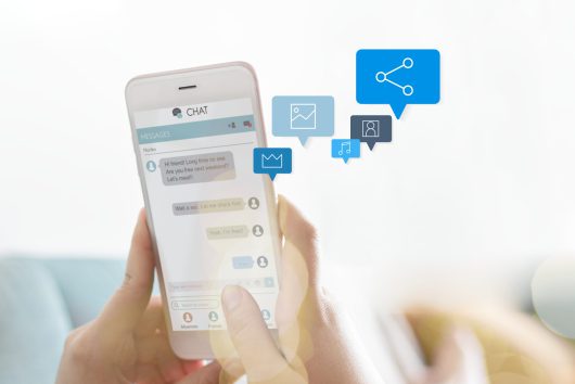 Woman texting on a couch